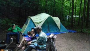 group sitting around the camp site